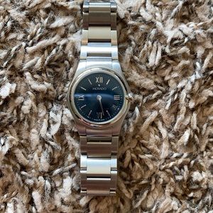 Silver Movado watch with navy blue face